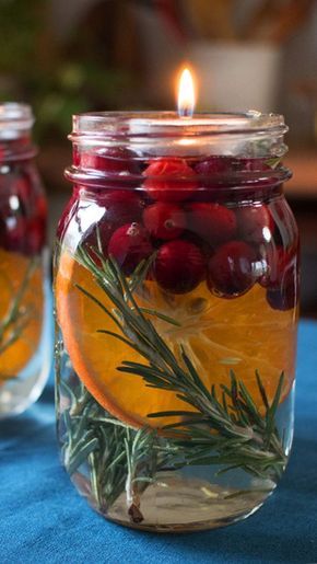 Rustic Candlelit Mason Jar Centerpiece for Christmas with dried berries and oranges
