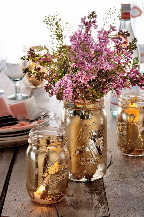 Mason Jar Centerpiece with violet flowers and gold leaf paint