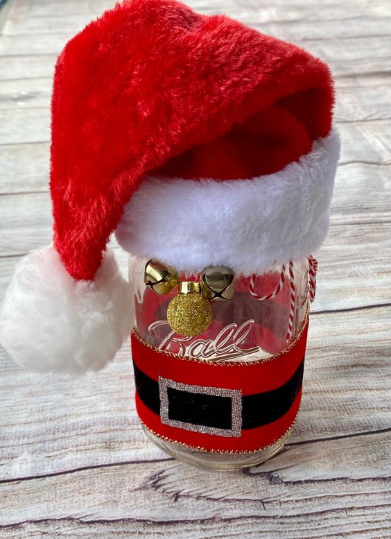 Mason jar with santa hat as a Christmas Tbale Centerpiece