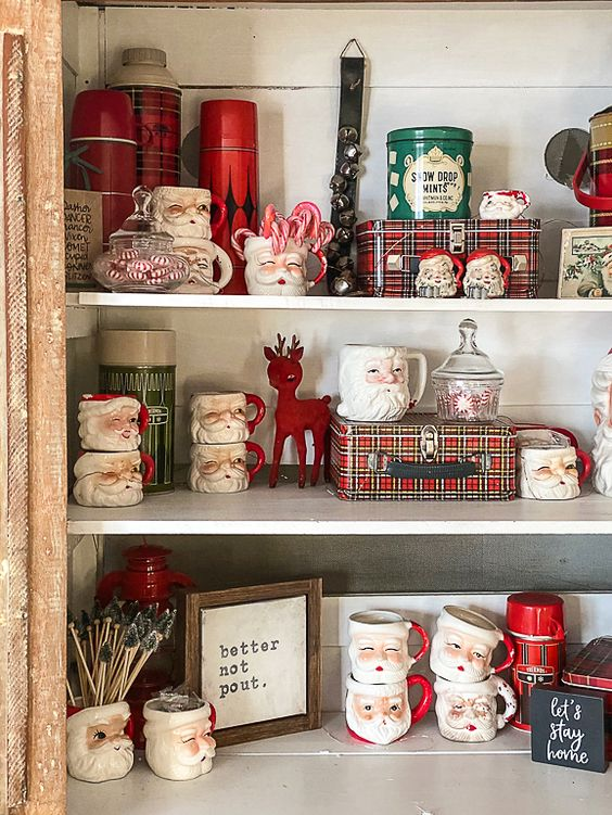  Vintage Christmas shelf decor ideas filled with antique figurines, vintage cards and tin storage boxes