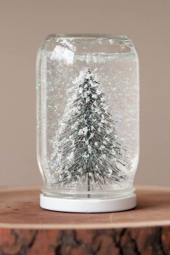 Snow globe made of mason jar as a winter crafts for adults