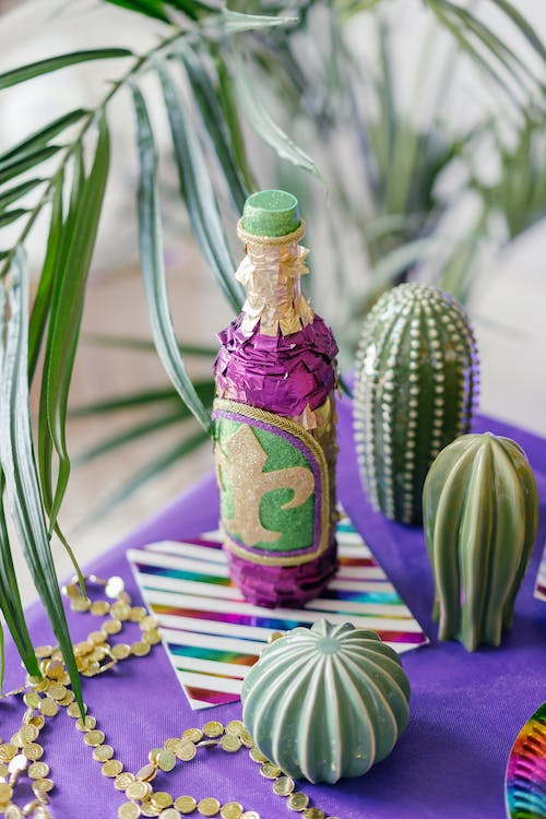 decorated empty bottles for Mardi Gras party ideas for adults