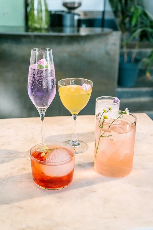Colorful Mardi Gras drinks with vodka for the celebration