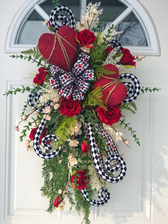 Valentine's door ideas with the use of plants and roses for a fresh welcoming vibe.