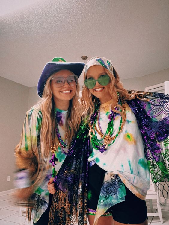 Mardi Gras party ideas for adults outfits in tie dyes of violet, gold and green colors with beaded necklace.