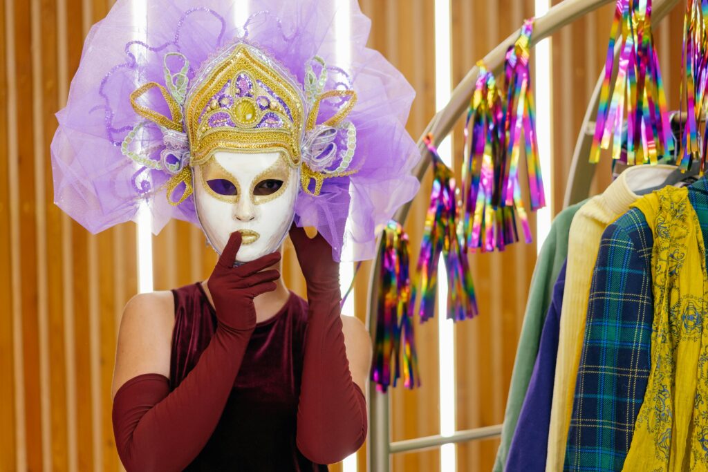 A woman in a mask getting ready for a Mardi Gras party ideas for adults