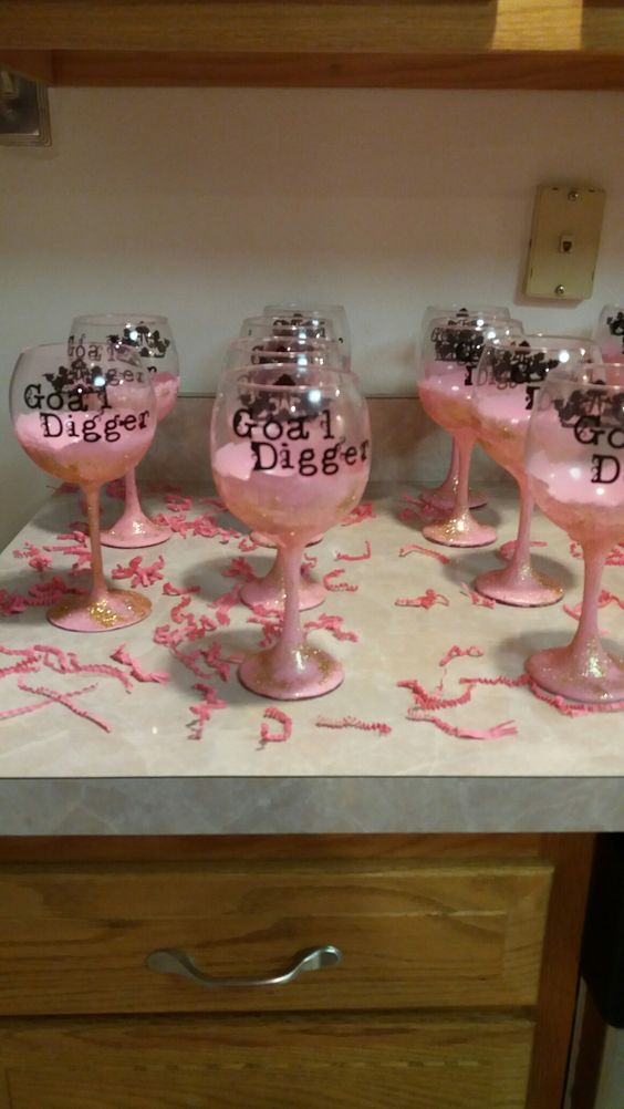 Wine glasses labeled with goal digger as a decor for vision board party ideas