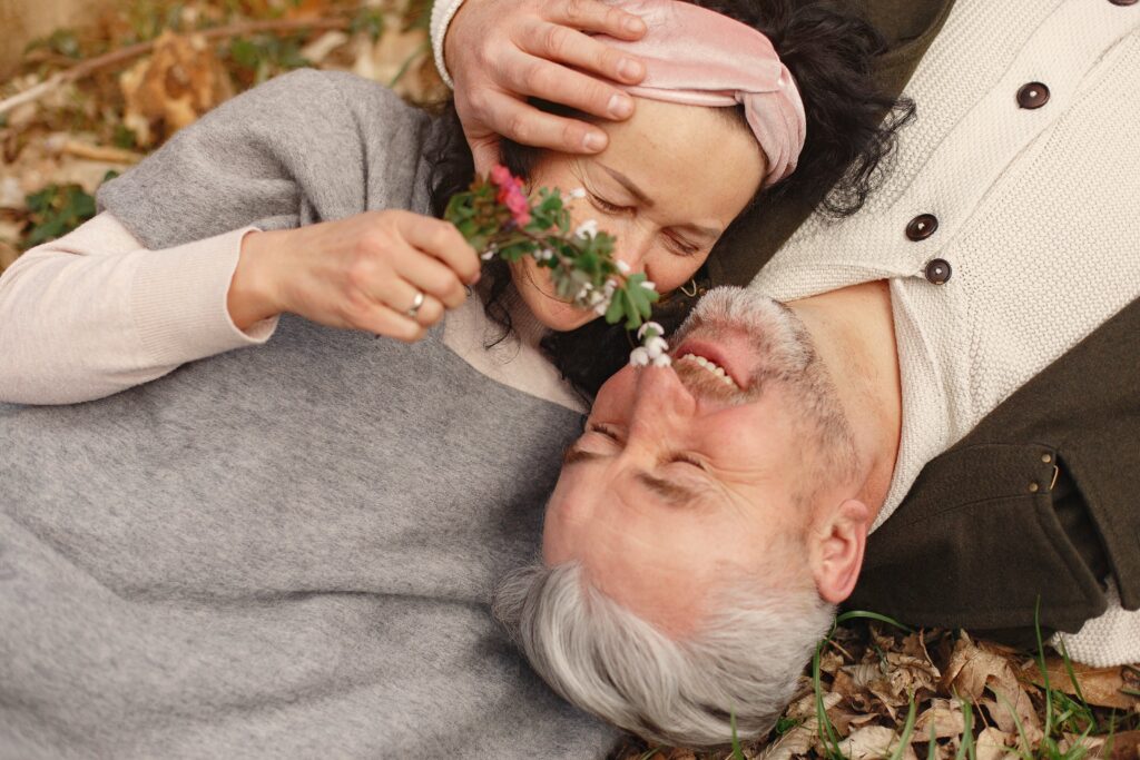 Married couple in their senior years having fun in the garden doing Valentine's Day Crafts for Seniors