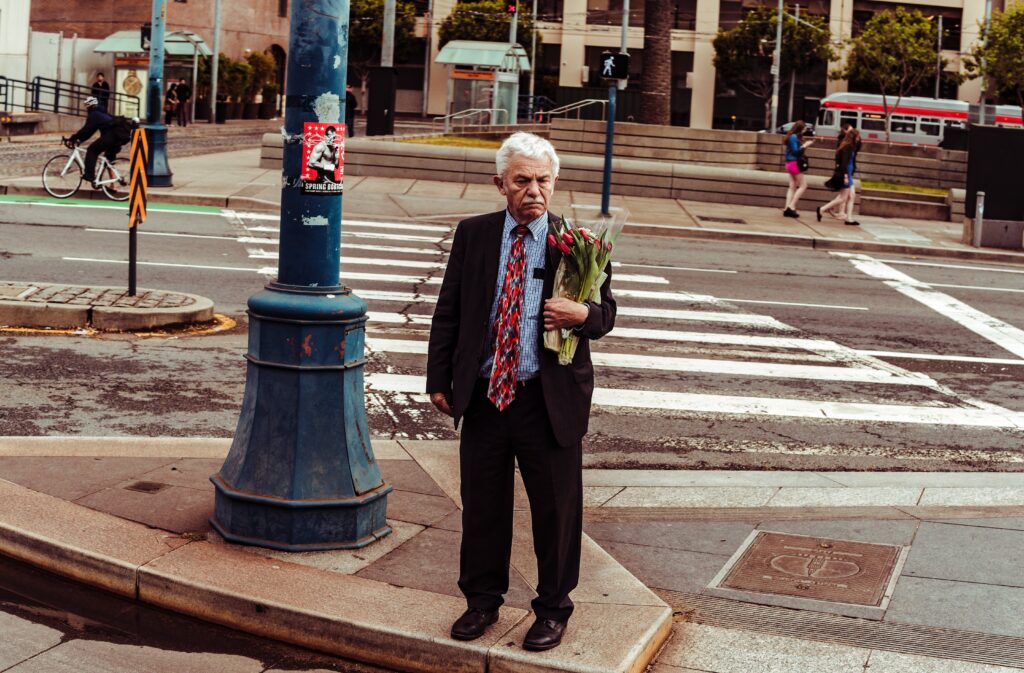 A Dad holding a bouquet of flowers about to cross the road but this time it is your turn to make him happy with Valentine's gifts for dad from daughter.